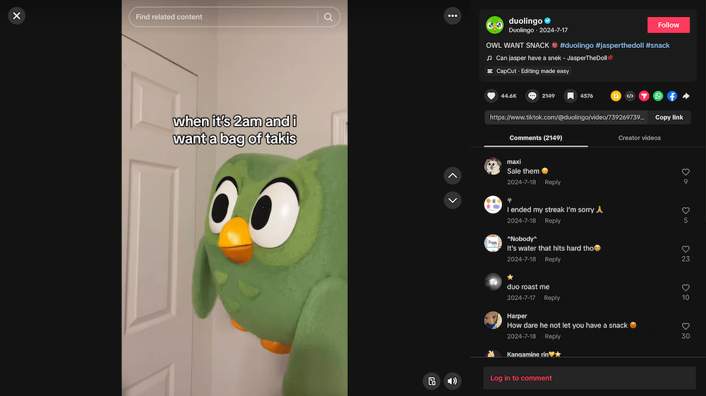 Screenshot of a TikTok video posted by Duolingo featuring a plushie version of the Duo mascot with on-screen text referring to a viral snack alongside follower comments.